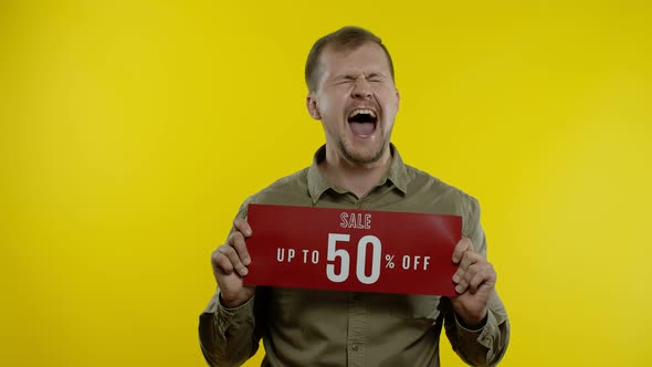 Man Showing Sale Up To 50 Percent Off Inscriptions Sign, Rejoicing Good Discounts, Low Prices alt
