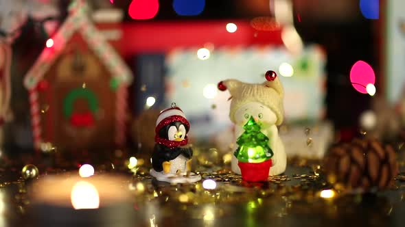 New Year Installation. Christmas Toys and Candles on the Background of Festive Lights alt