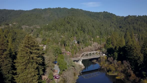 Drone flying over the top of a truss bridge on the Russian river in Sonoma county California alt