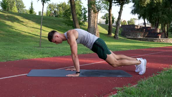 Sportsman Doing Rock Climber Exercise on Fitness Mat Outdoor Sport alt