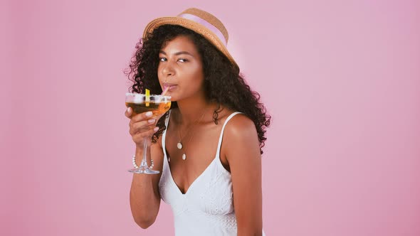 Darkskinned Female in Hat Jewelry and White Dress alt