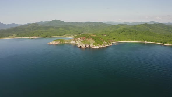 Drone View of the Rocks and Grottoes of Cape Kuzmin in the Gulf of Vladimir alt