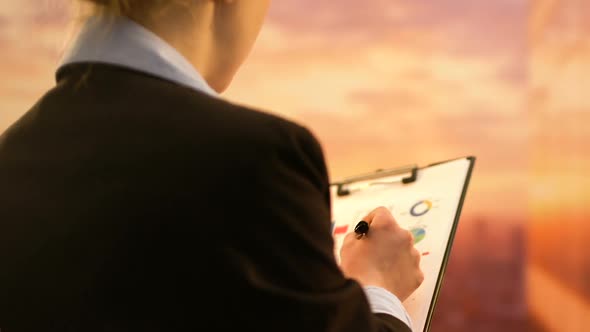 Beautiful Company CEO Working on Business Project, Checking Statistics in Report alt