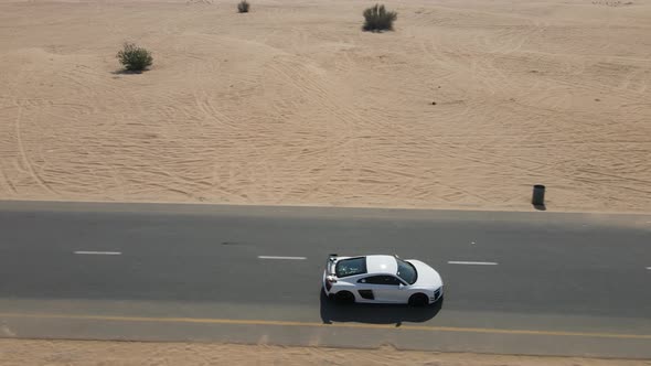 Sport Car Driving on a Desert Road