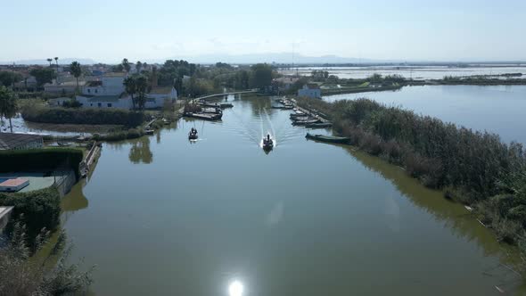 Aerial Drone Footage of Boats with Tourists on It to Visit the Natural Park of the Albufera in alt