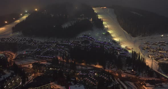 Night Illumination Cityscape Center Square Mountain Popular Ski Resort. Details of Modern House alt