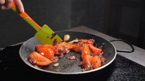Restaurant. Chef Stirs Tomato, Onion with Spatula Before Adding Sea Mussels. Slow Motion. Cooking alt
