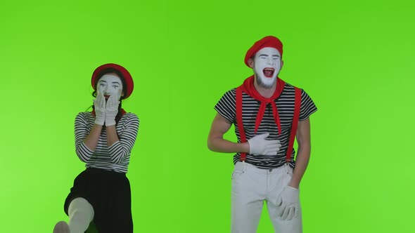 Mimes Are Laughing On A Green Background
