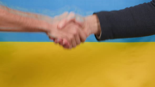 Peace Agreement Handshake with Ukrainian Flag in Background alt