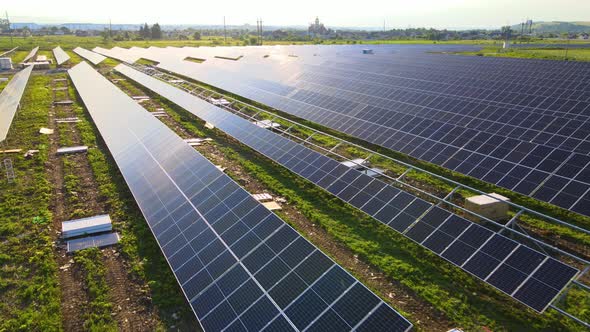 Aerial View of Big Electric Power Plant Under Construction with Many Rows of Solar Panels on Metal alt