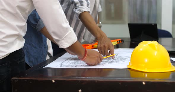 Engineer Architects Office Team Working And Discussing With Blueprints alt