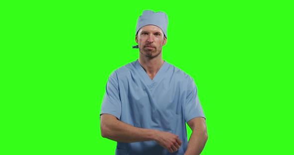 Caucasian male doctor on green screen background alt