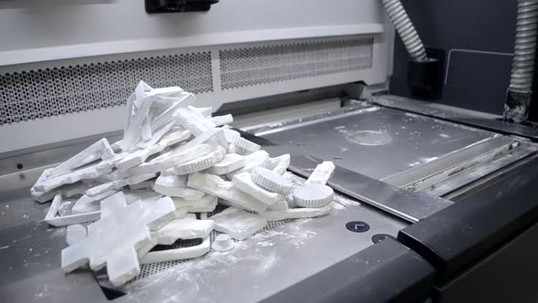 Objects and Models Printed on Industrial 3D Printer From White Plastic Powder alt