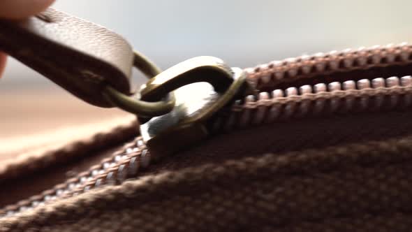 Man Zips Up His Bag, Vintage Bag, Close Up View