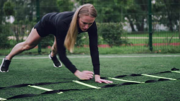 Woman Training Speed Ladder Drills alt