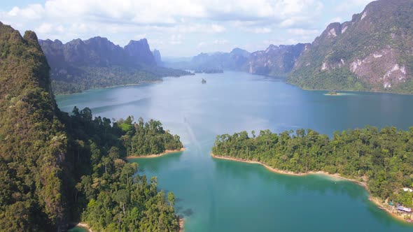 Aerial view landscape view Mountain in lake Refection sky with cloud on lake water. 4K Nature video alt