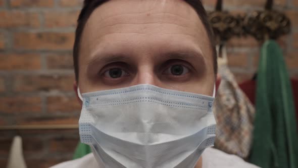 Portrait of a Man in a Medical Mask Closeup