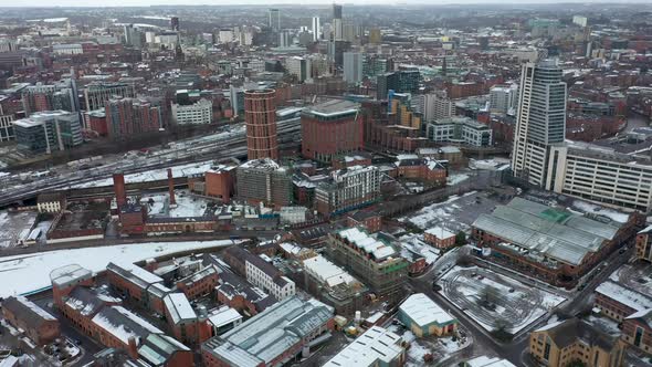 Aerial footage of a snowy winters day in the city of Leeds in the UK alt