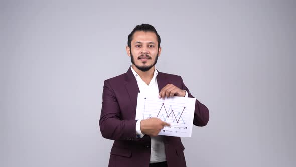 Indian businessman explaning analytics of the company alt