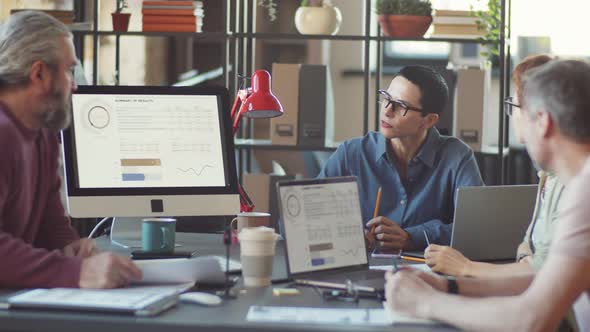 Business Team Discussing Project at Office Meeting alt