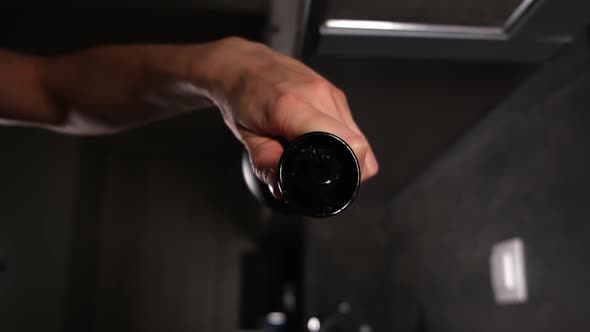 Close up slow motion of pouring olive oil on frying pan. alt