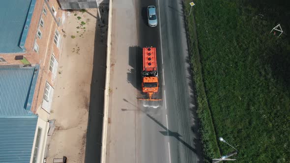Big Machine Clears the Asphalt with Water Streams alt