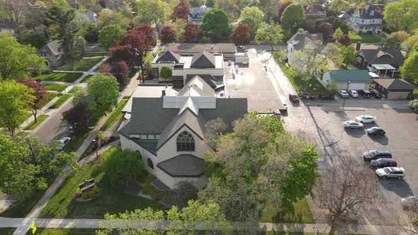 Aerial view of sprawling church building in Wisconsin. Tree lined streets in the neighborhood.