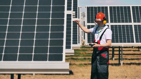 Engineer Is Measuring Tension in Solar Panels alt