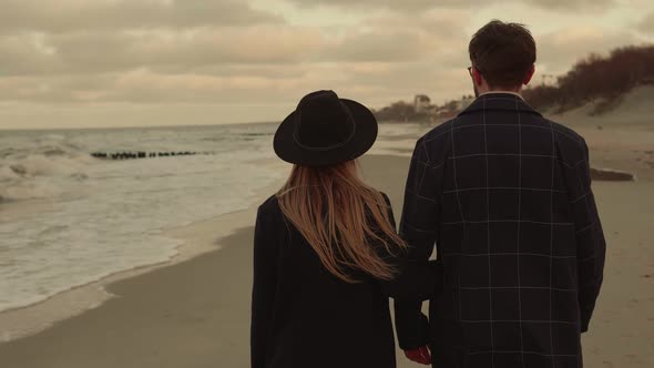 Young Couple Walking Along the Coast