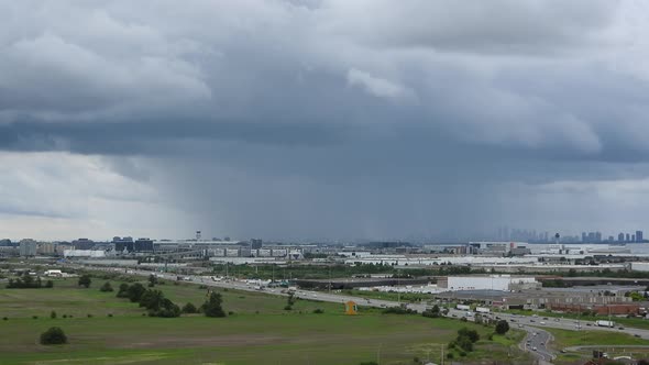 massive rainstorm falling over Toronto, Canada, at summer daytime. Timelapse, cityscape alt