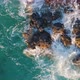 Aerial Top View Of Sea Wave Hitting Cliffs Of A Rocky Coast - VideoHive Item for Sale