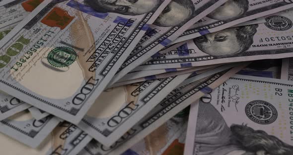 American Dollar Bills with Cash Money Scattered Banknotes on the Table alt