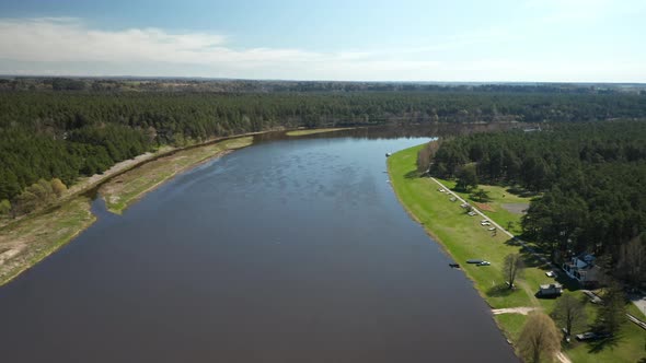 AERIAL: Wide River Nemunas on a Sunny Day in Birstonas alt