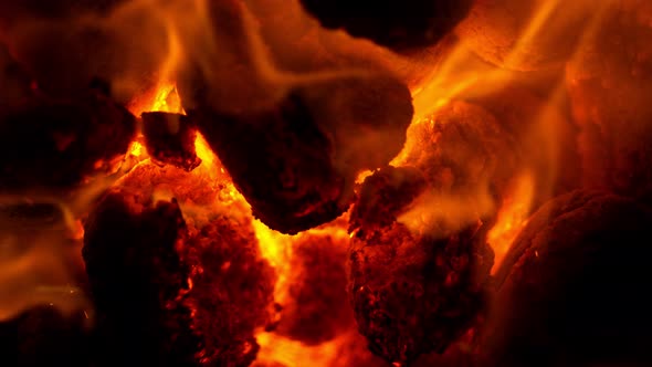 Super Slow Motion Shot of Glowing Coal and Fire Sparks at 1000Fps alt
