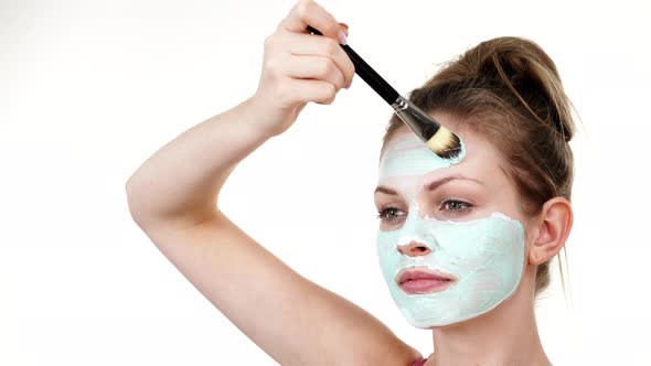 Girl Apply Mud Mask to Face