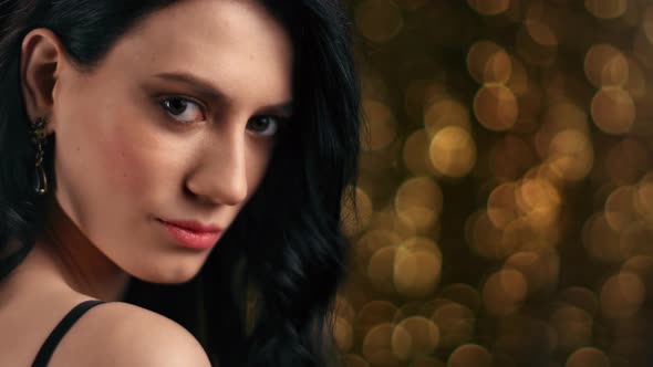 Closeup Face of Fashion Lady Posing at Golden Light Bokeh alt