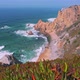 Footage of Praia Do Ursa Beach with Beautiful Orange Colored Cliffs and Foliage in Foreground - VideoHive Item for Sale