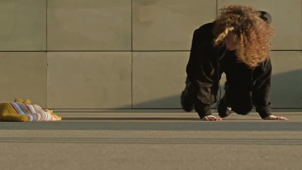 Hurrying Girl in an Underpass Stumbles and Drops Her Bag alt