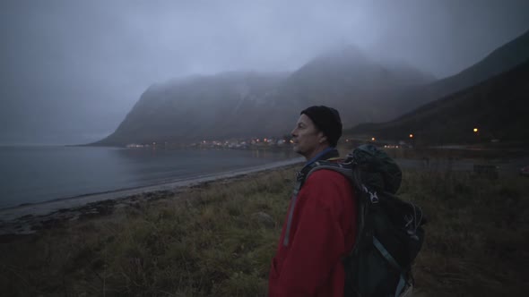 Hiker At Misty Fjord With Mountains alt