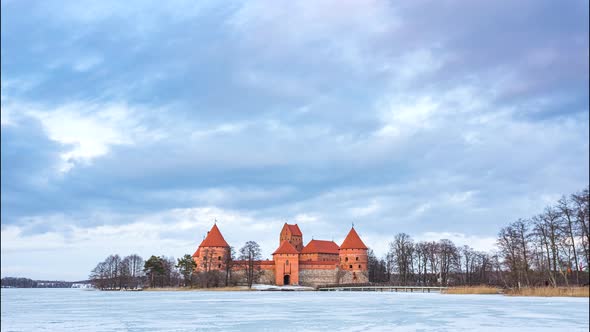 Day to evening timelapse of Trakai medieval castle in Lithuania at winter, 4k timelapse
