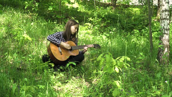 Girl Playing the Guitar alt