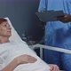 Patient Signing Form Lying in Hospital Bed - VideoHive Item for Sale