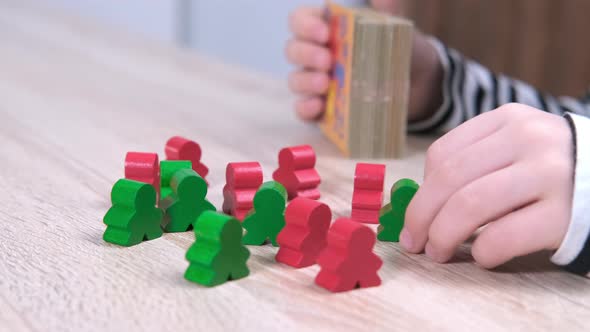 Board Game and Kids Leisure Concept Boys Hands Close Up Playing Wood Chips People Figure in Children alt
