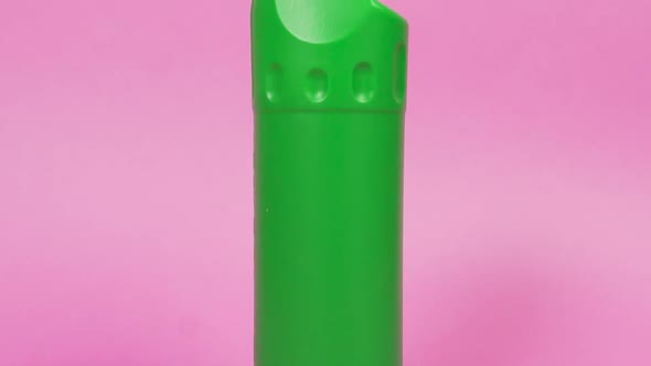 Green Bottle Made of Recycled Plastic with Household Chemicals