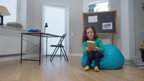 Wide Shot Living Room with Desk and Chalkboard and Caucasian Little Person Entering Sitting Down on alt