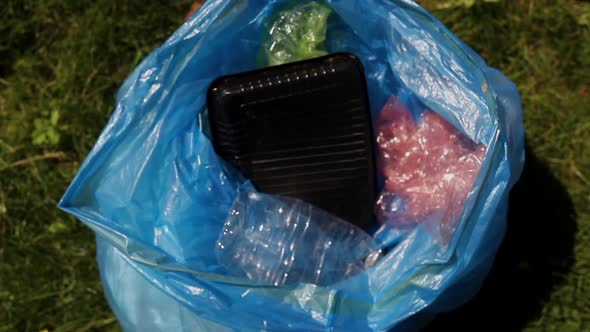 Young Family Recycle Plastic Bottle Volunteers Shaking Hands While Cleaning at Green Park on a alt