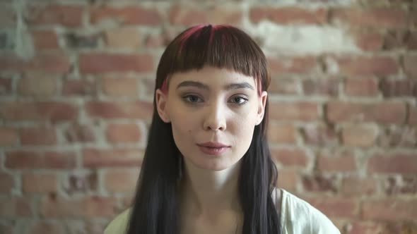 Portrait of a Young Attractive Young Woman with Hipster Hairstyle alt