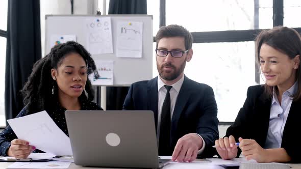 Business Partners Working Together on a Project alt