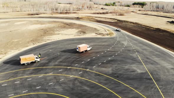 Aerial View of Pickup Truck That Drives Along Track of Proving Ground alt