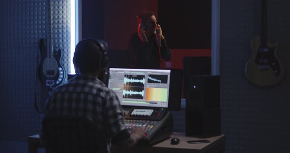 Actor Doing Voice Over in Sound Studio alt